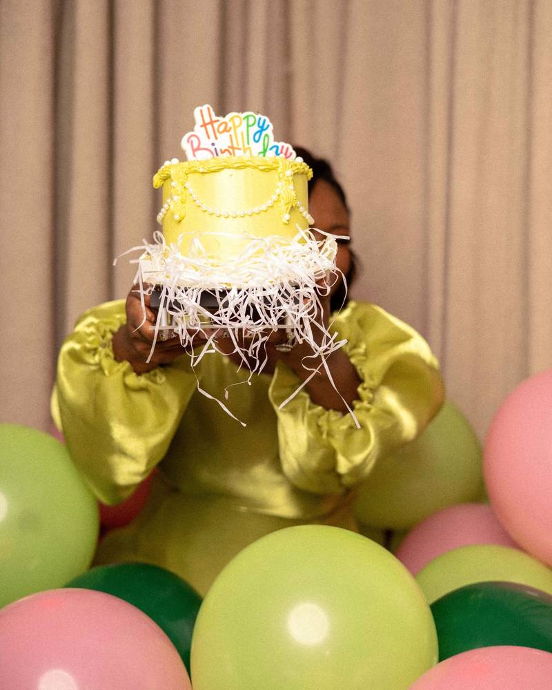 A child carrying a birthday cake