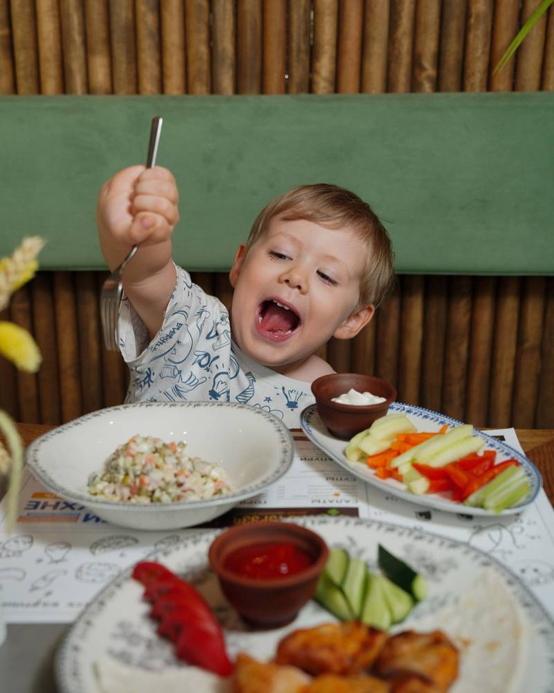 A child eating a meal at the cafe