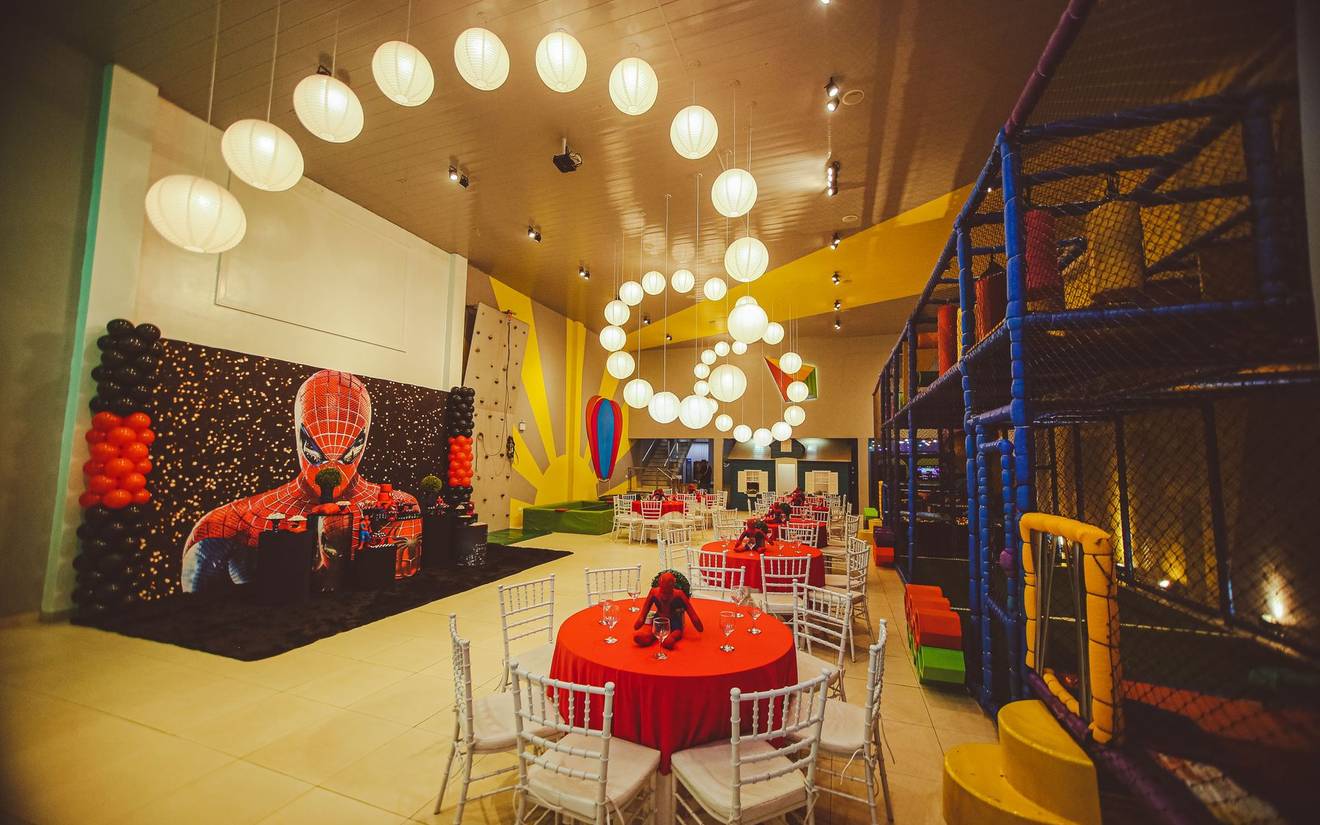 The indoor play structure and party tables at Mom's The Boss Kids Cafe
